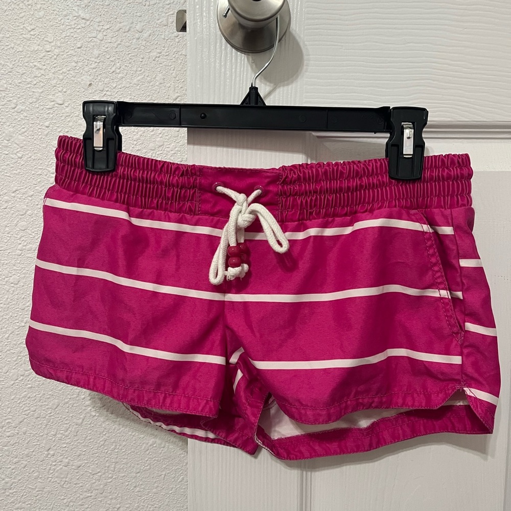 Selling swimsuit cover up shorts, size small. Hot pink with white stripes.